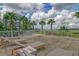 Relaxing patio featuring lounge chairs and palm trees at 136 Cooper River Dr, Mount Pleasant, SC 29464