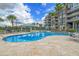 Inviting pool area with lounge chairs and a covered cabana, perfect for relaxation and enjoying the beautiful surroundings at 136 Cooper River Dr, Mount Pleasant, SC 29464