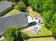 Aerial view of backyard with a fire pit surrounded by Adirondack chairs at 138 Avalon Rd, Summerville, SC 29483
