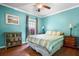 Comfortable bedroom featuring hardwood floors, a ceiling fan, and bright, natural light at 138 Avalon Rd, Summerville, SC 29483