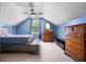 This blue bedroom has a ceiling fan and a window, with a dresser in the corner at 138 Avalon Rd, Summerville, SC 29483