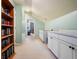 Bright hallway features built-in cabinets, bookshelves, and a glimpse into a room beyond at 138 Avalon Rd, Summerville, SC 29483