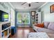 Cozy living room with a comfortable couch, a side table, a bookshelf, and lots of natural light at 138 Avalon Rd, Summerville, SC 29483