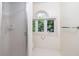 Bathroom featuring a glass shower and a window that provides natural light at 1415 Inland Creek Way, Mount Pleasant, SC 29464