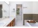 Bright bathroom with double sink vanity, patterned tiles, and a relaxing bathtub at 1415 Inland Creek Way, Mount Pleasant, SC 29464
