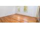 Bright bedroom featuring hardwood floors and two windows that provide natural light at 1415 Inland Creek Way, Mount Pleasant, SC 29464