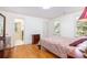 Bedroom with wood floors, dresser, and attached bathroom at 1415 Inland Creek Way, Mount Pleasant, SC 29464