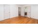 Spacious bedroom featuring hardwood floors, connecting doors, and ample natural light at 1415 Inland Creek Way, Mount Pleasant, SC 29464