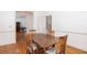 Dining room featuring a wooden table and chairs, with hardwood floors and a view to the office space and staircase at 1415 Inland Creek Way, Mount Pleasant, SC 29464