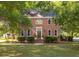 Lovely two-story brick home featuring an inviting front entrance and manicured landscaping at 1415 Inland Creek Way, Mount Pleasant, SC 29464
