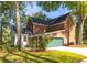 Two-story brick and siding home with attached garage and a cozy patio area at 1415 Inland Creek Way, Mount Pleasant, SC 29464