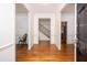 Elegant home foyer with hardwood floors, detailed moldings, and open stairway at 1415 Inland Creek Way, Mount Pleasant, SC 29464