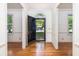 Home foyer with hardwood floors, white trim, and natural light, creating an inviting entrance at 1415 Inland Creek Way, Mount Pleasant, SC 29464