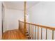 Hallway with hardwood floors and wooden railing at 1415 Inland Creek Way, Mount Pleasant, SC 29464