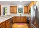 U-shaped kitchen with wooden cabinets, stainless steel appliances, and a breakfast bar at 1415 Inland Creek Way, Mount Pleasant, SC 29464