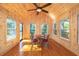 Wood-paneled sunroom with natural light, hardwood floors, and a ceiling fan at 1415 Inland Creek Way, Mount Pleasant, SC 29464