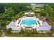 Aerial view showcasing the large community pool with surrounding amenities and lush landscaping at 1488 Croaton Crsg, Mount Pleasant, SC 29466