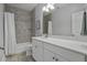Bathroom with tile flooring, white cabinets, quartz countertop and shower with tile surround at 1488 Croaton Crsg, Mount Pleasant, SC 29466