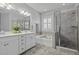 Spacious bathroom features a soaking tub, glass enclosed shower, double sink vanity, and tiled floors at 1488 Croaton Crsg, Mount Pleasant, SC 29466