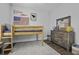 A bedroom features a lofted bed with a wood dresser and playful decor against gray walls at 1488 Croaton Crsg, Mount Pleasant, SC 29466