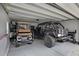Spacious garage featuring a golf cart, and a customized Jeep Wrangler with aftermarket accessories at 1488 Croaton Crsg, Mount Pleasant, SC 29466