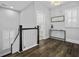Hallway with beautiful hardwood flooring, natural lighting, and a view into another room at 1488 Croaton Crsg, Mount Pleasant, SC 29466