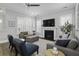 Inviting living room features a fireplace, comfortable seating, and a ceiling fan for added comfort at 1488 Croaton Crsg, Mount Pleasant, SC 29466
