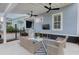Covered outdoor patio featuring comfortable seating, ceiling fans and an outdoor TV at 1488 Croaton Crsg, Mount Pleasant, SC 29466