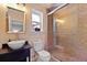 Well-lit bathroom with a vessel sink, glass shower, and tile surround at 1514 Gardenia Rd, Charleston, SC 29407