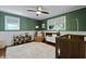 View of Bedroom with green walls, chair, changing table, and soft shag carpeting at 1514 Gardenia Rd, Charleston, SC 29407