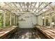 Sun-filled greenhouse with potting benches, gravel floor, and translucent roof panels at 1514 Gardenia Rd, Charleston, SC 29407