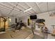 Home gym featuring workout machines, free weights, and TV for entertainment at 1514 Gardenia Rd, Charleston, SC 29407