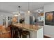Bright kitchen featuring a large island with seating, pendant lighting, and stainless steel appliances at 1514 Gardenia Rd, Charleston, SC 29407