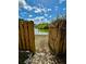 Picturesque backyard featuring a gate leading to a serene pond view at 1516 Blaze Ln, Charleston, SC 29412