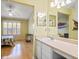 Bright bathroom with a vanity and a view into an adjacent bedroom at 1516 Blaze Ln, Charleston, SC 29412