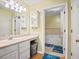Well-lit bathroom featuring a vanity, ample storage, and a separate tub and shower area at 1516 Blaze Ln, Charleston, SC 29412