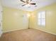 Carpeted bedroom with ceiling fan, window, and neutral wall color at 1516 Blaze Ln, Charleston, SC 29412