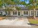 Charming single-story townhome with a well-maintained front yard and a concrete driveway at 1516 Blaze Ln, Charleston, SC 29412