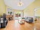 Bright and airy living room featuring a stone fireplace and sliding glass doors to the outdoor area at 1516 Blaze Ln, Charleston, SC 29412