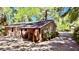 View of the home, with brick facade, from the backyard featuring a covered patio at 1521 Camp Rd, Charleston, SC 29412