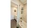Bathroom with shower and tub combo and open door to vanity area with ample storage and natural light at 1521 Camp Rd, Charleston, SC 29412