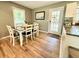 Charming dining area featuring a modern table, and a view of the backyard through a glass door at 1521 Camp Rd, Charleston, SC 29412