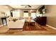 Bright living room showcasing a sectional sofa, hardwood floors, TV, and a warm area rug at 1521 Camp Rd, Charleston, SC 29412