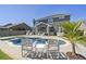 A stunning backyard featuring a pool and spa, an outdoor seating area, a patio, and a lush green lawn at 1537 Fishbone Dr, Johns Island, SC 29455