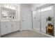 Well-lit bathroom with quartz countertops, sleek vanity, and a tiled glass shower enclosure at 1537 Fishbone Dr, Johns Island, SC 29455
