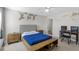 A delightful bedroom featuring a wooden platform bed, playful monkey wall art, and carpet floors at 1537 Fishbone Dr, Johns Island, SC 29455