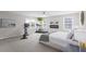 Spacious bedroom featuring modern decor, a ceiling fan, lots of windows, and natural light at 1537 Fishbone Dr, Johns Island, SC 29455