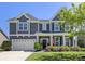 Beautiful two-story home featuring manicured landscaping and a two-car garage at 1537 Fishbone Dr, Johns Island, SC 29455