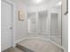 Hallway with multiple mirrors creating a spacious feel with neutral carpet and light walls at 1537 Fishbone Dr, Johns Island, SC 29455