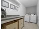 Well-organized laundry room featuring a countertop, modern washer and dryer, and stylish decor at 1537 Fishbone Dr, Johns Island, SC 29455